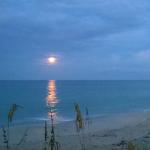 Chill out at the end of the day with a full moon over the ocean